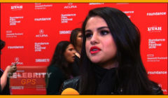 Selena gomez interviewed at the sundance film festival, standing before a red backdrop with event logos.