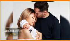 A couple holding a newborn baby affectionately, with the father kissing the mother's forehead. the image includes a "celebrity gps" watermark.