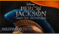 Promotional image for "percy jackson and the olympians" featuring a close-up of a blue-dyed feathered helmet with greek design elements, logo at top, and an orange banner.